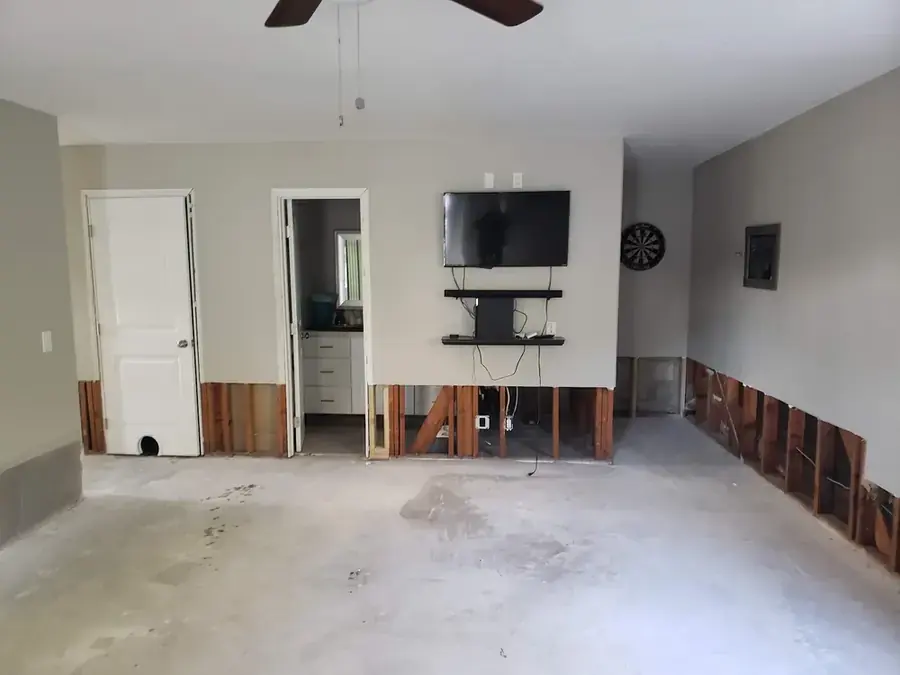 Baseboards removed to dry the walls in a Chula Vista, CA home