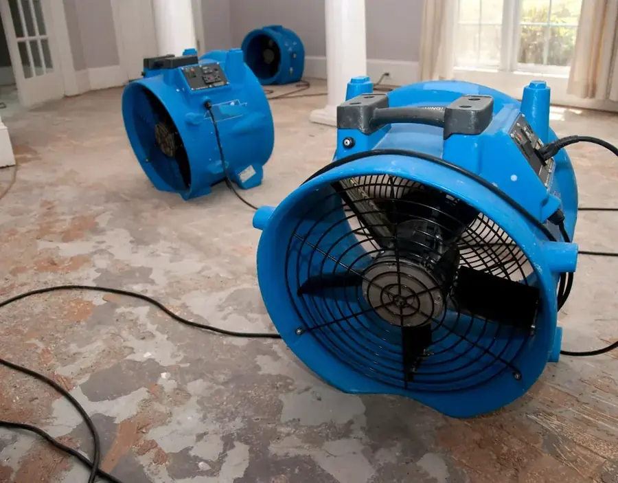 A high-volume air mover running on a floor in a Chula Vista, CA home