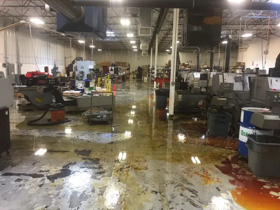 Restoration technician drying a flooded Chula Vista, CA property with air movers