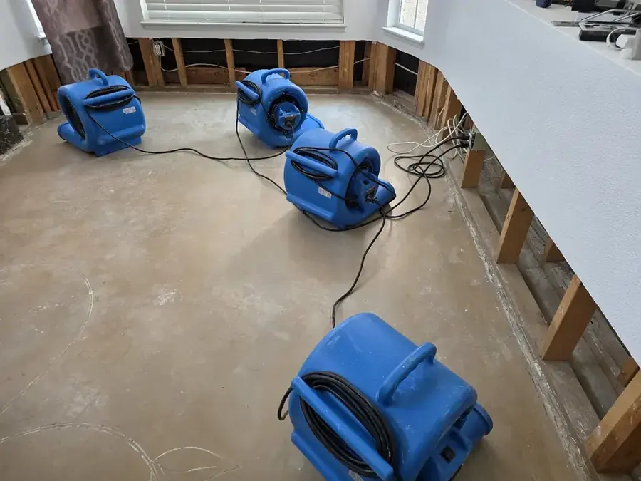 Air movers and dehumidifiers drying a Chula Vista, CA room